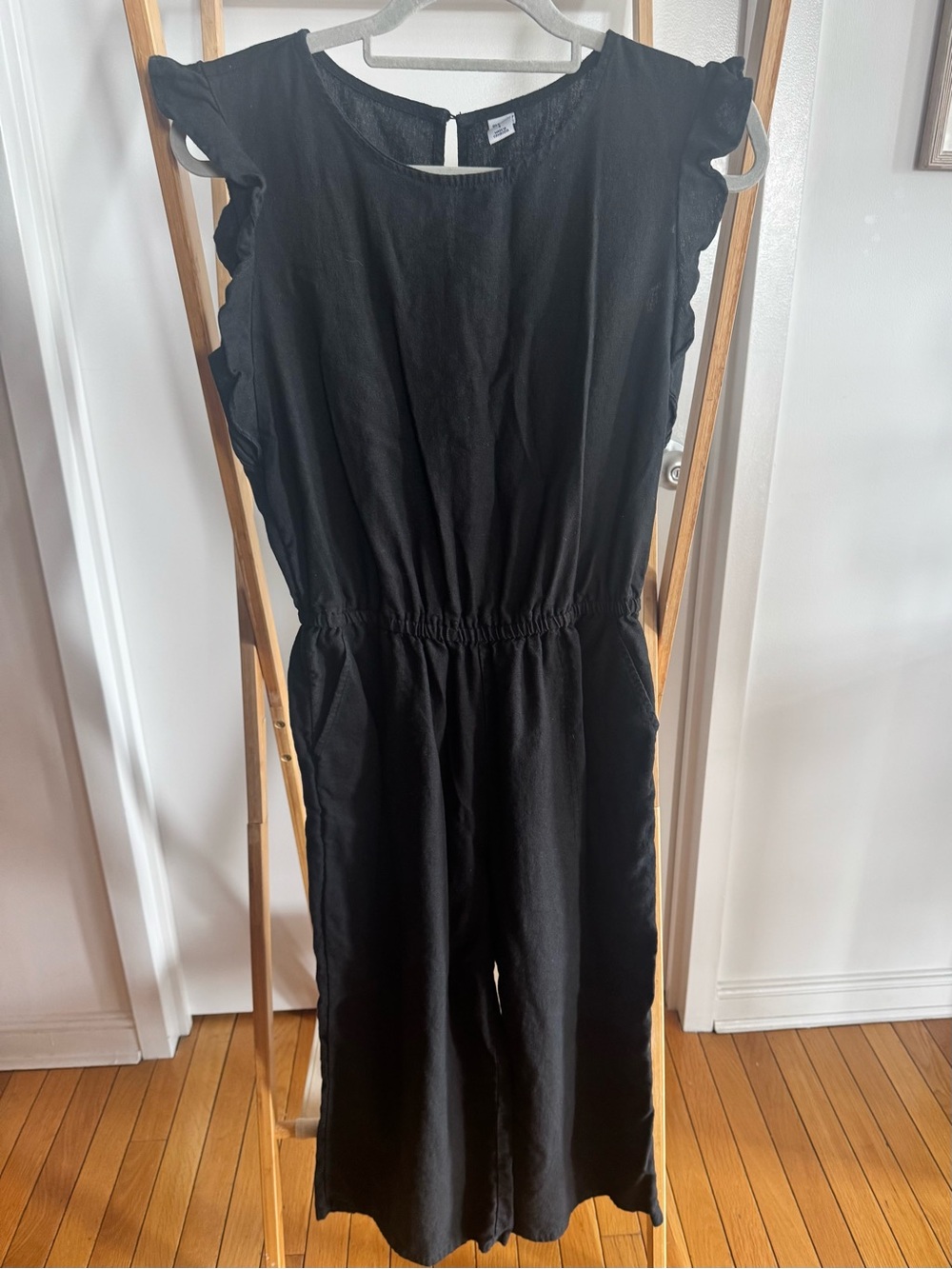 Black Ruffle-Sleeve One-Piece Jumpsuit in linen
